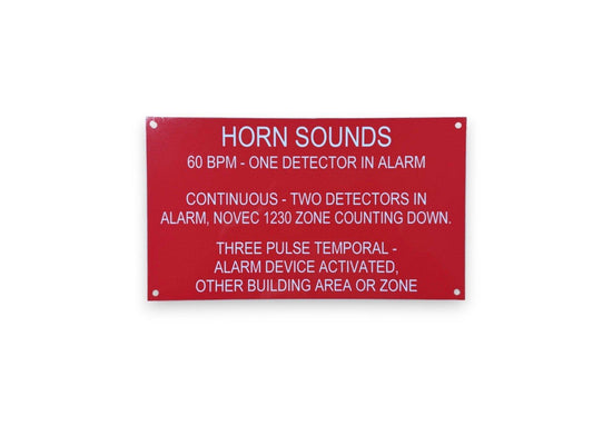Red fire alarm horn sound indicator sign explaining detector alarm patterns and zone signals