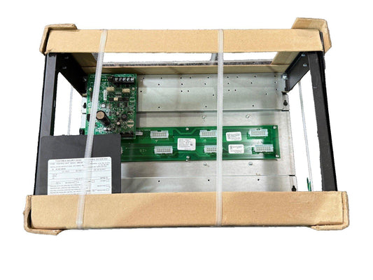 Fire alarm control panel with circuit boards, secured in shipping box for safe delivery