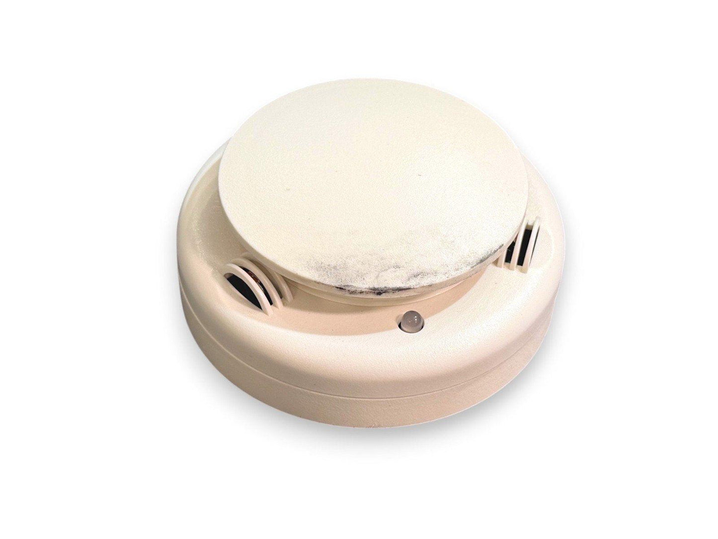 White smoke detector with vented sides and indicator light for fire alarm systems
