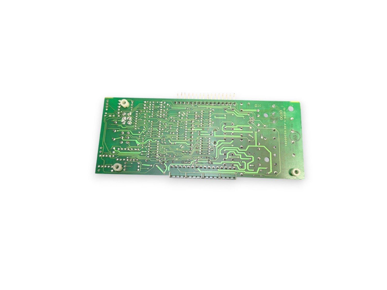 Green fire alarm control panel circuit board with connectors and mounting holes