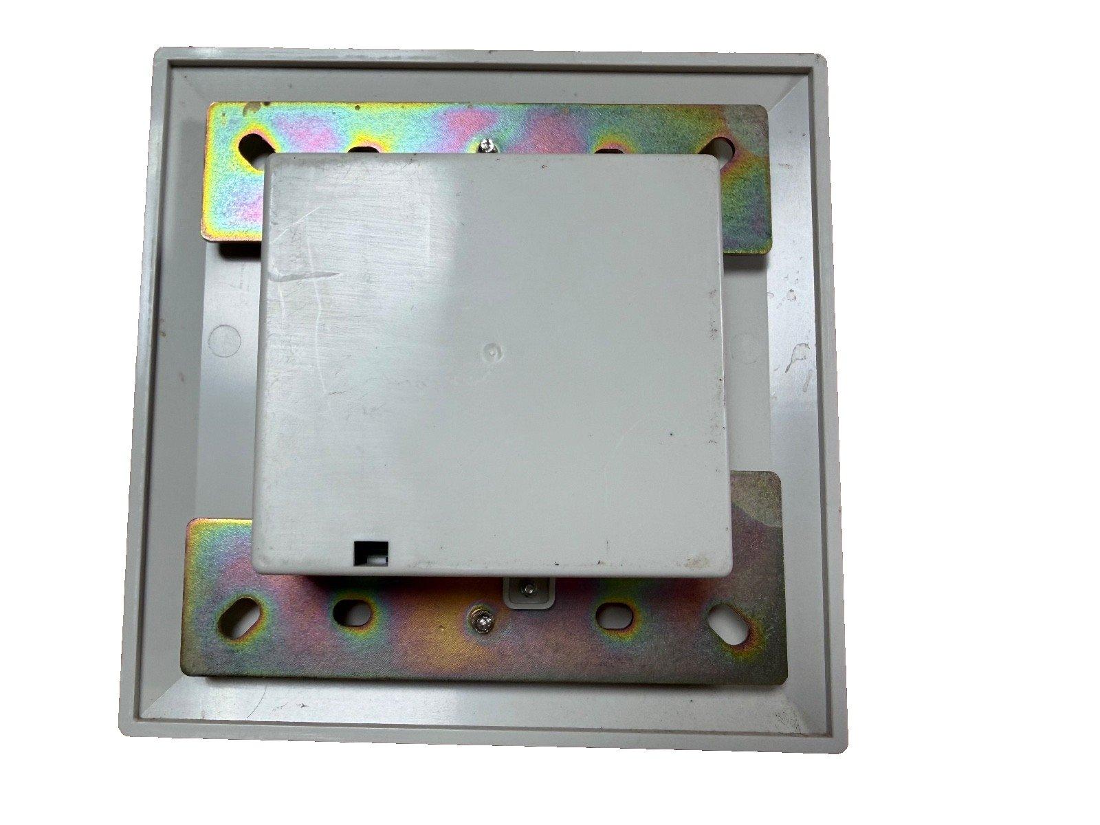 Fire alarm control panel module with mounting bracket and metal backplate