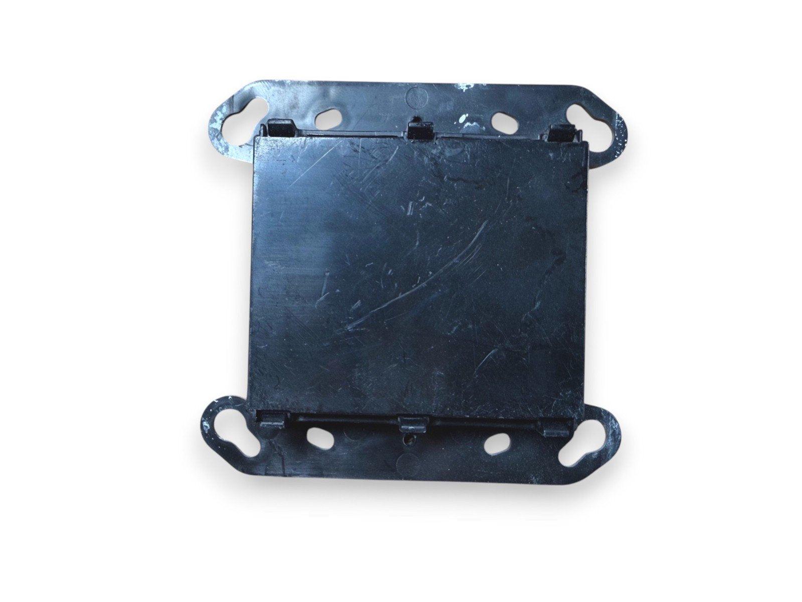 Black fire alarm mounting bracket with screw holes for secure installation