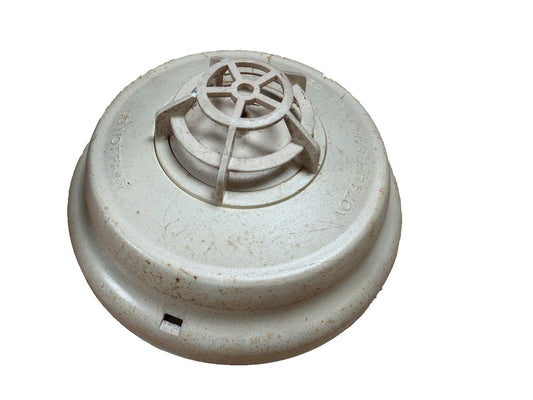 Used white smoke detector with vented top, for fire alarm systems