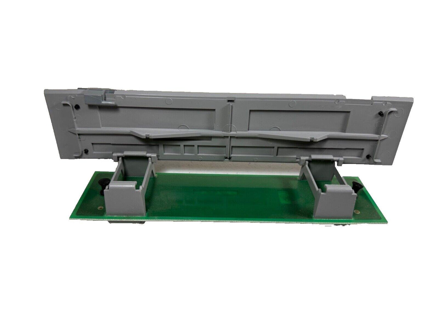 Fire alarm control panel circuit board with gray housing and green PCB, compatible with commercial fire systems