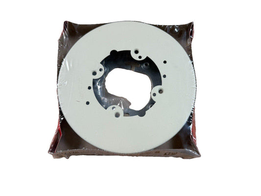 White fire alarm base plate with mounting holes, sealed in plastic packaging