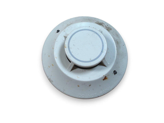 Used white fire alarm smoke detector with 'DO NOT PAINT' label, showing wear and dirt