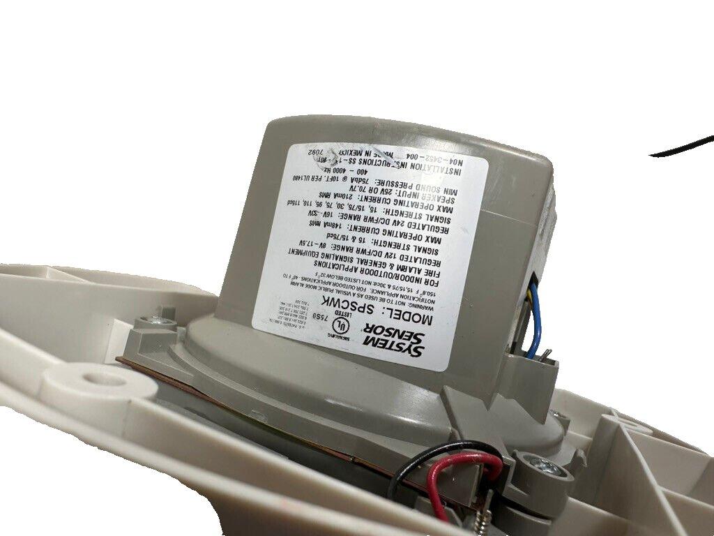 System Sensor SPSCWK fire alarm sounder with wiring, for indoor/outdoor use, model label visible