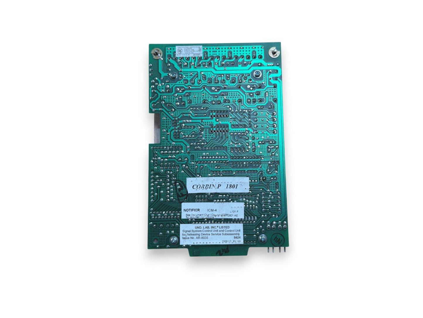 Green fire alarm control board with Corbin P1801 and ICM-4 notifier labels, UL listed for system control.