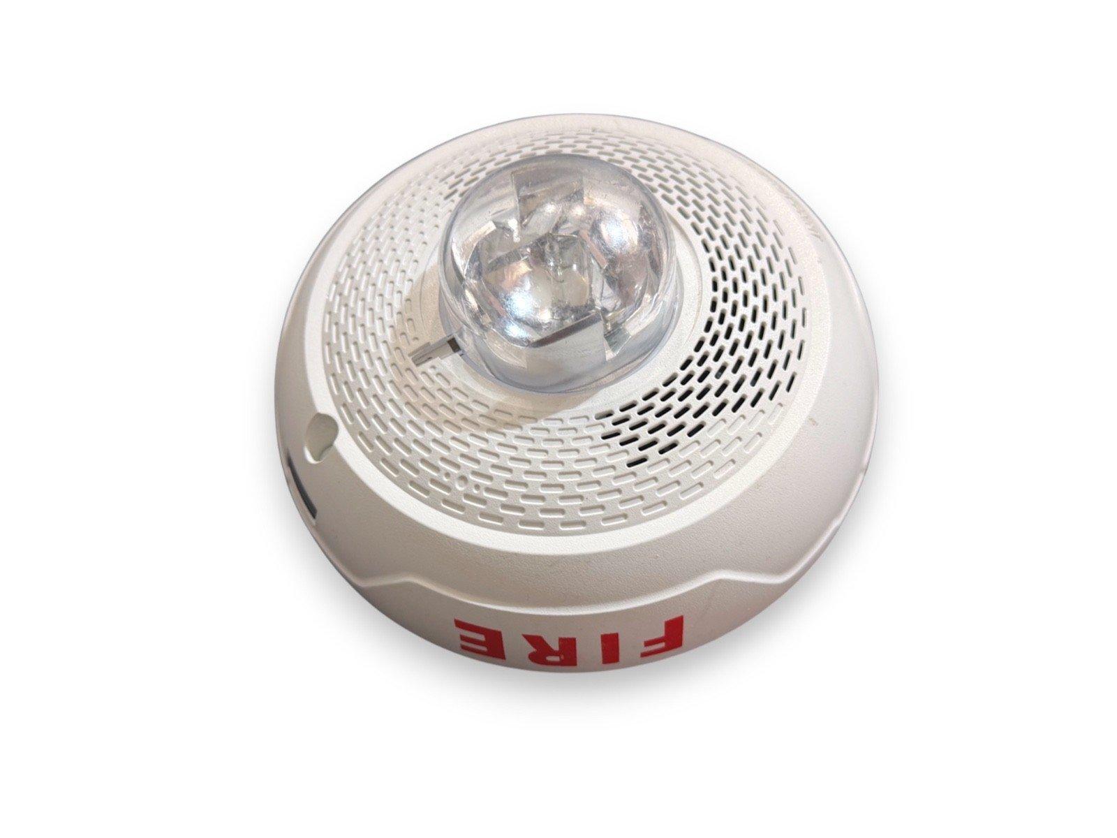 White fire alarm strobe light with red FIRE label, circular design and clear lens for emergency signaling