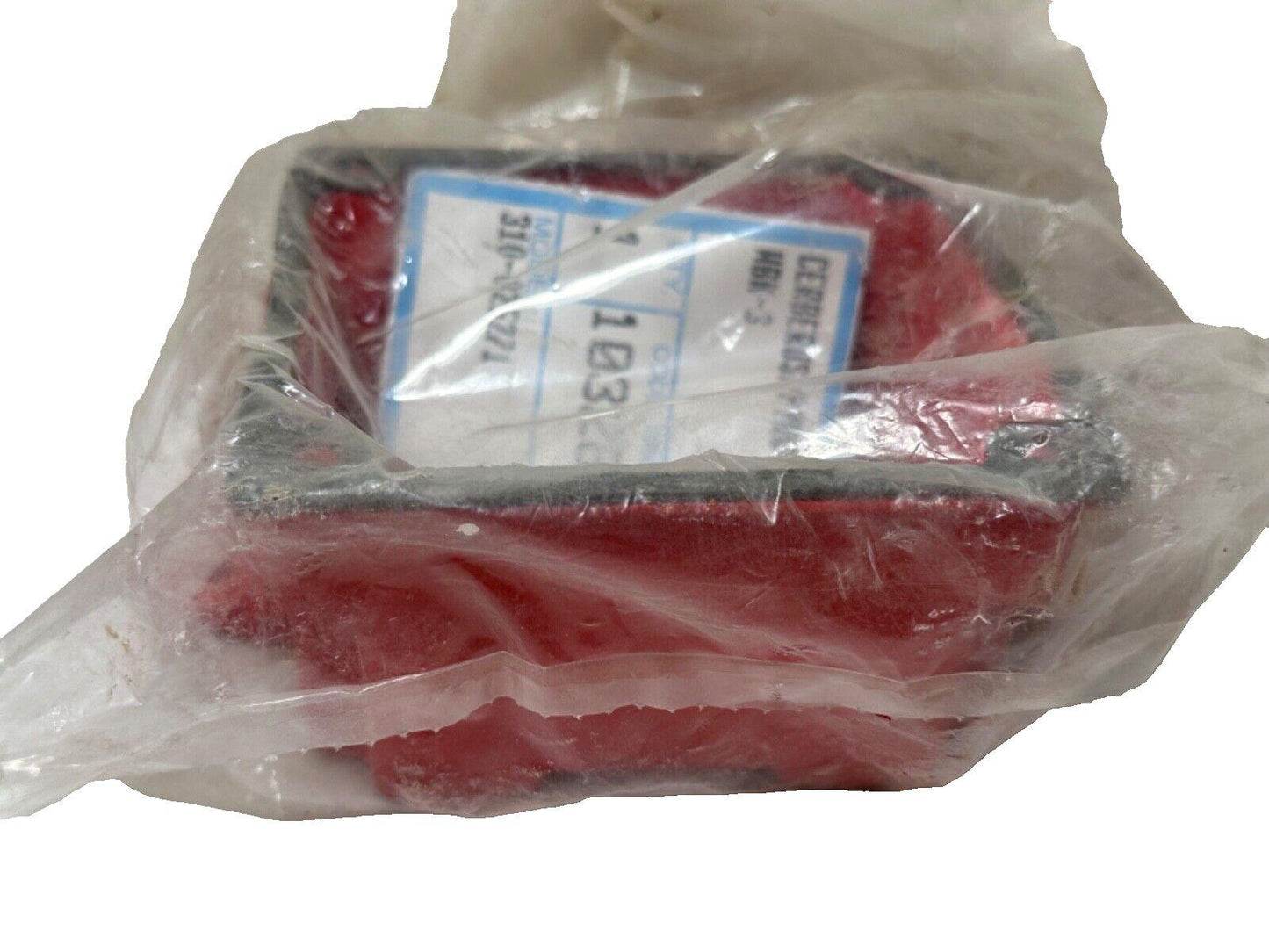 Red fire alarm device in plastic wrap, labeled MBK-3, model 310-0257/1