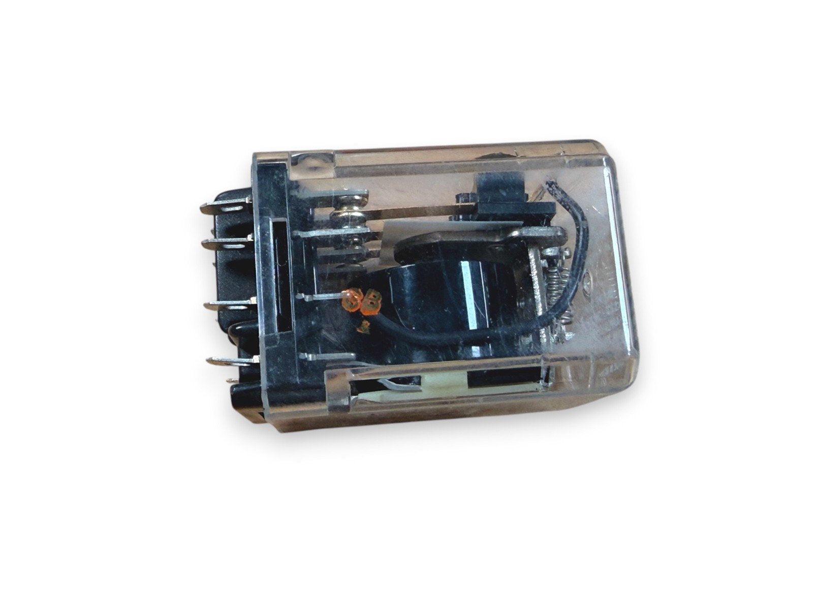 Clear-cased fire alarm relay with visible internal components and metal terminals for wiring connections