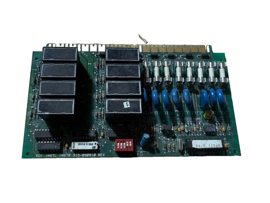 Fire alarm control panel circuit board with relays, fuses, and capacitors for fire safety systems