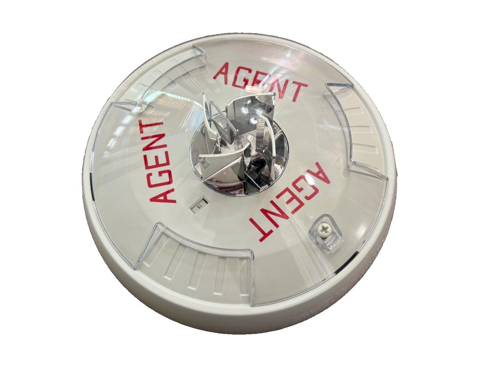 White fire alarm detector with red 'AGENT' text, clear cover, and metallic sensor for fire safety systems