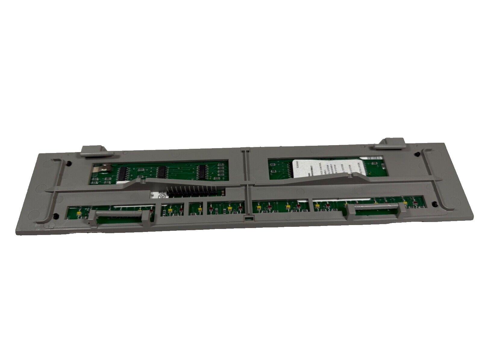 Fire alarm control panel circuit board with green PCBs and connectors for fire safety systems