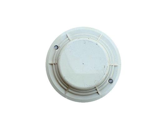 White ceiling-mounted fire alarm detector with mounting screws, used fire safety equipment