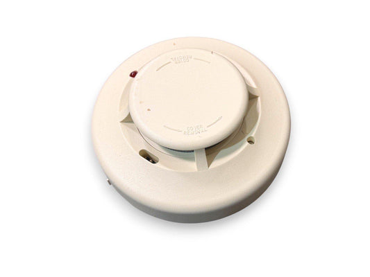Beige smoke detector with cover removal instructions and red LED indicator for fire alarm systems