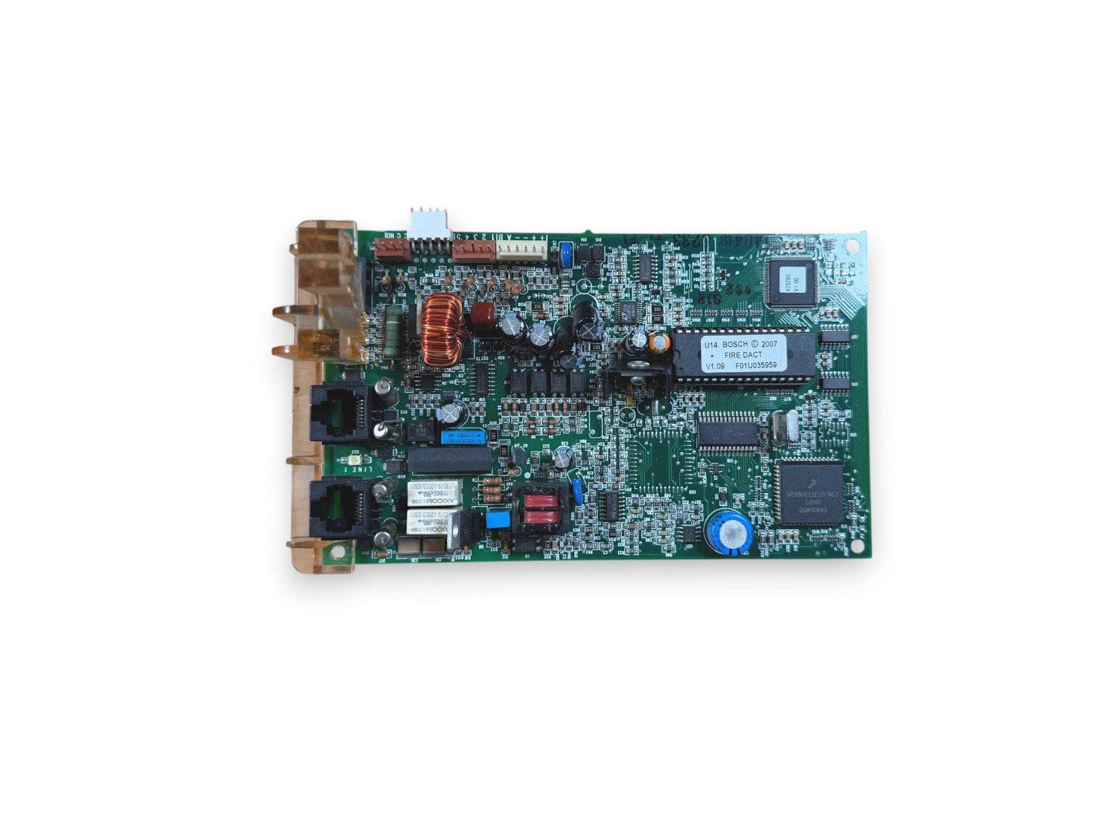 Bosch fire alarm control panel circuit board with DACT module, capacitors, and connectors for fire safety systems