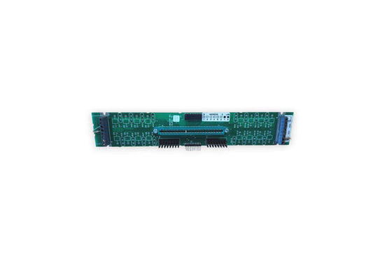 Green fire alarm control panel circuit board with connectors and address switches for fire safety systems