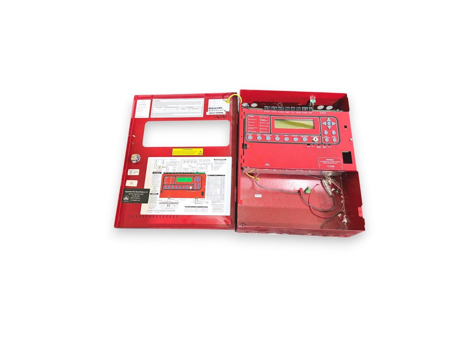 Red fire alarm control panel with open door, wiring, and digital display for commercial fire safety systems