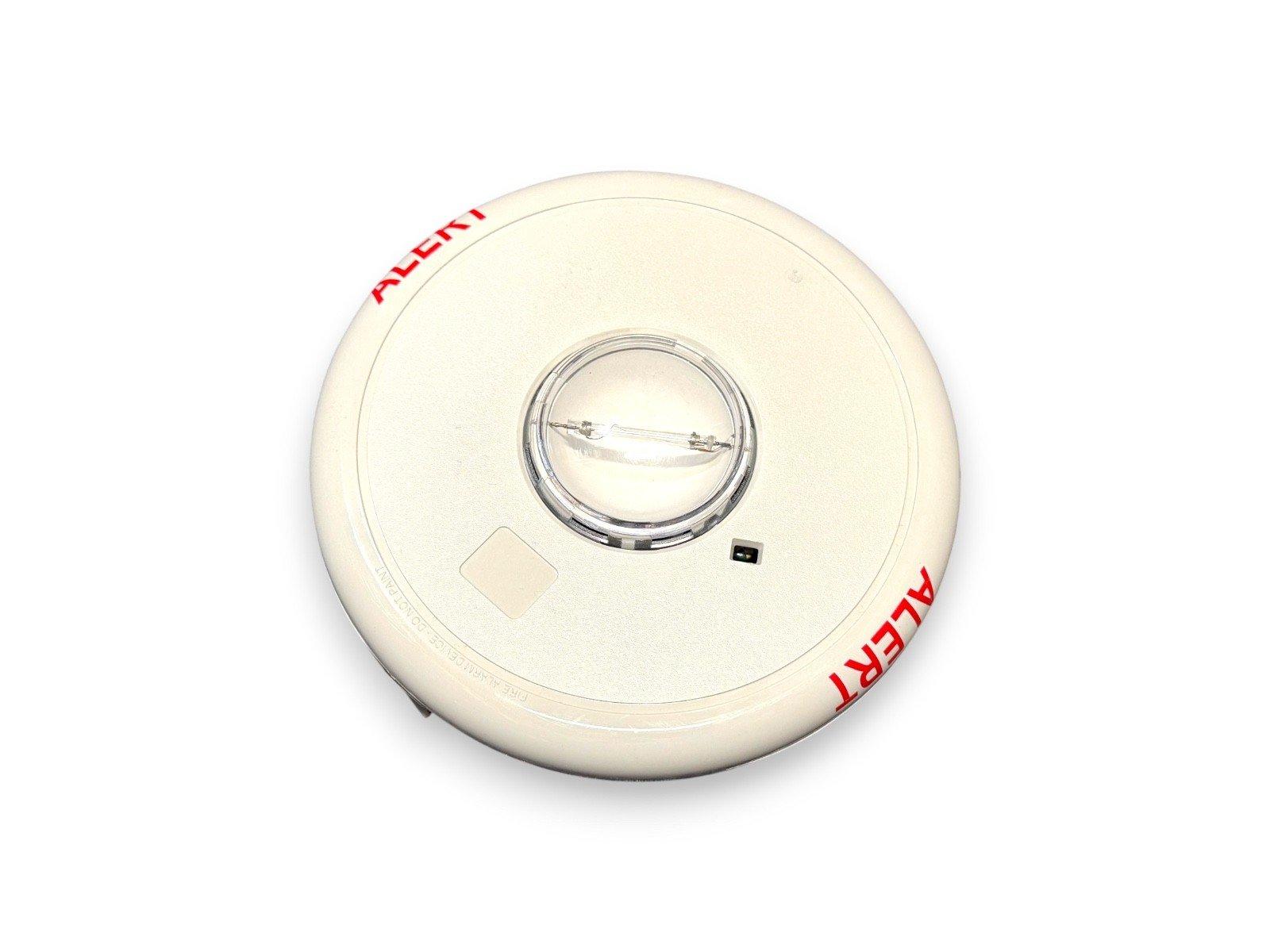 White fire alarm strobe with red ALERT text, circular design, clear lens, for commercial safety systems