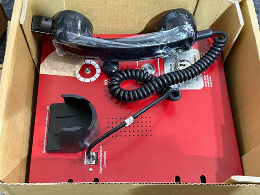 Red fire alarm intercom with black handset in box, featuring volume control and supervised connection