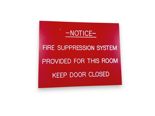 Red fire suppression system notice sign: 'Keep Door Closed' for room safety