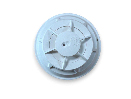 White ceiling-mounted fire alarm detector with radial vents and central sensor
