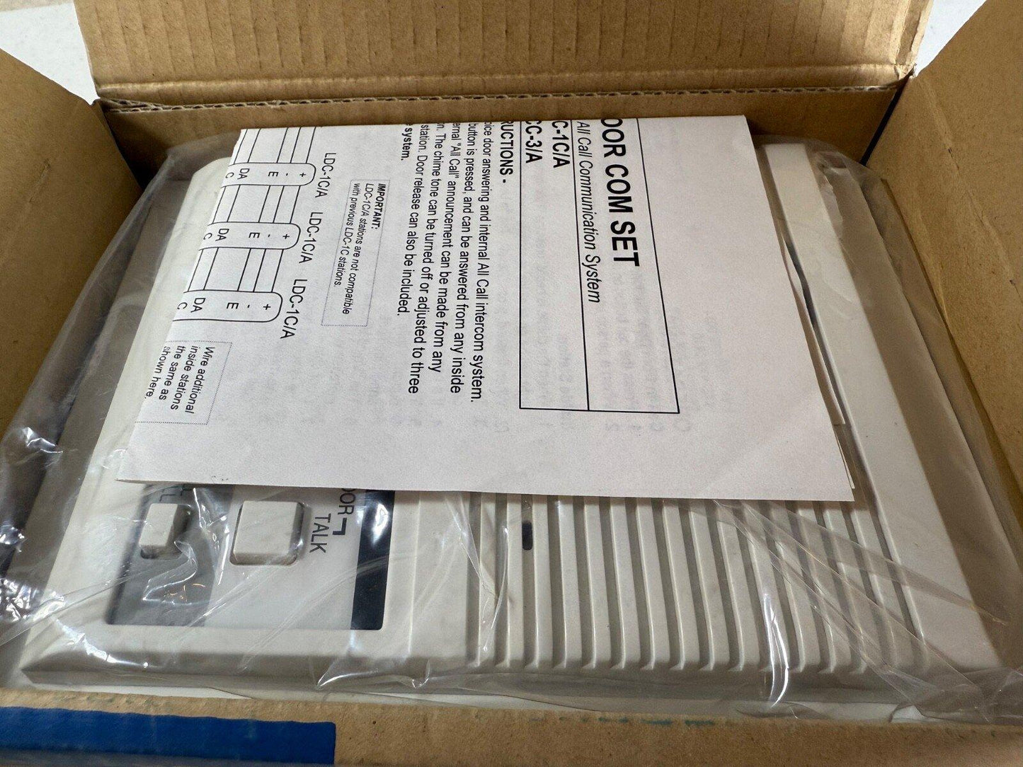 White door com set intercom system with instruction sheet, packaged for fire alarm equipment