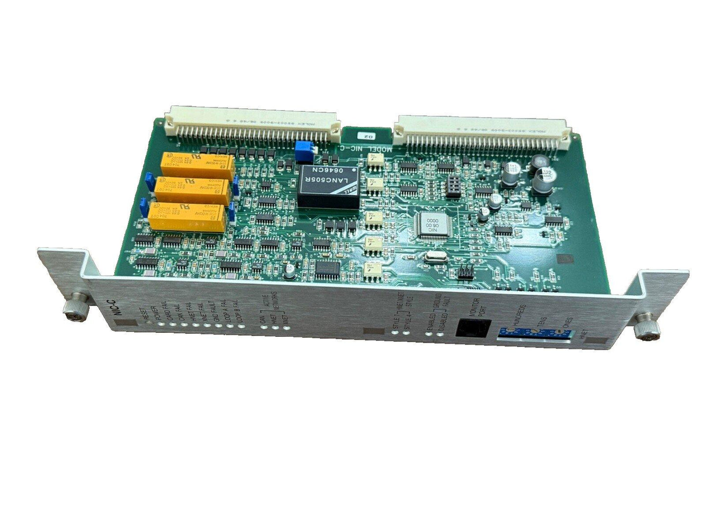 Fire alarm control panel circuit board with NIC-C module and network connectors for commercial systems