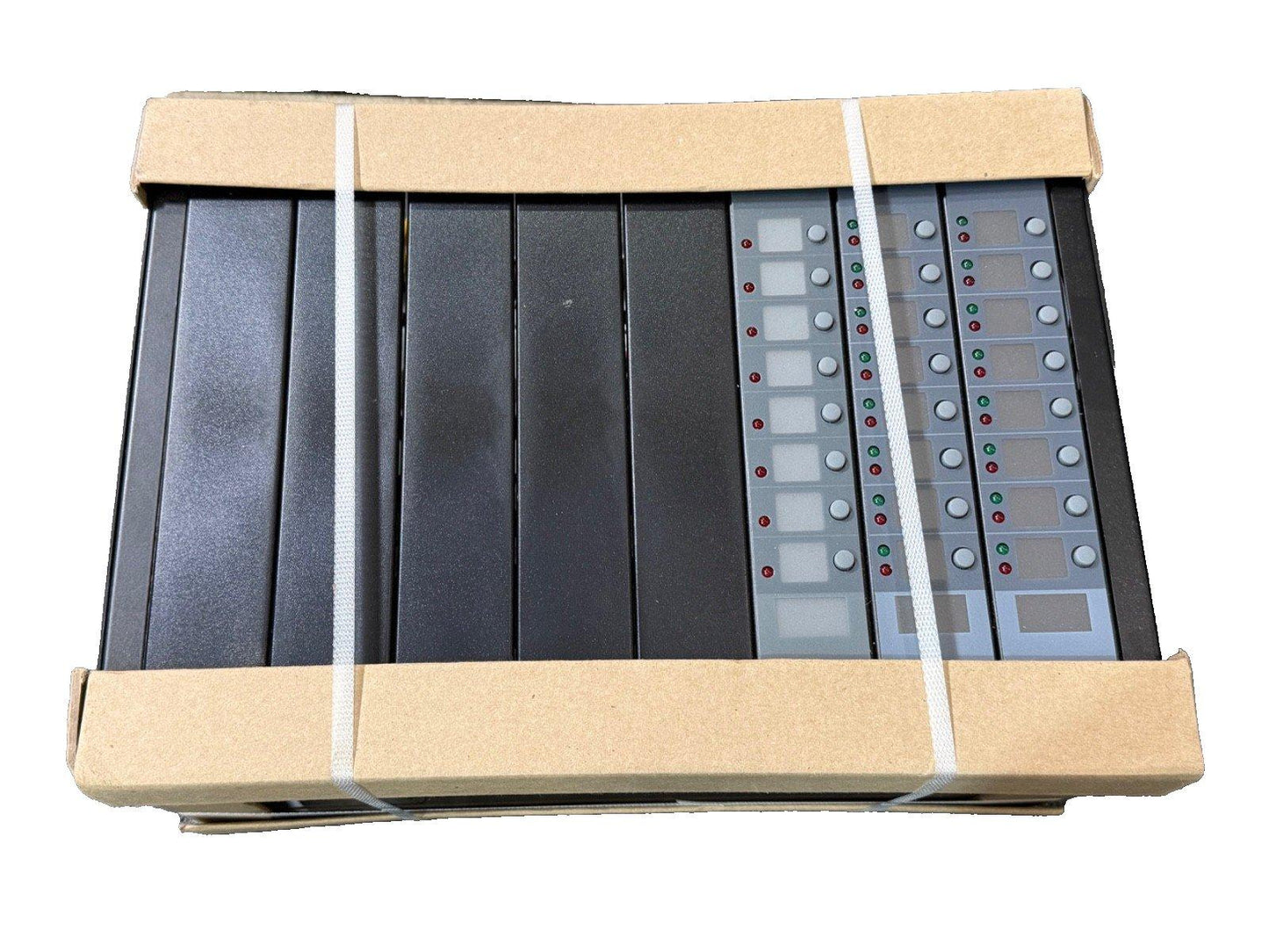 Fire alarm control panels in shipping box with indicator lights and buttons