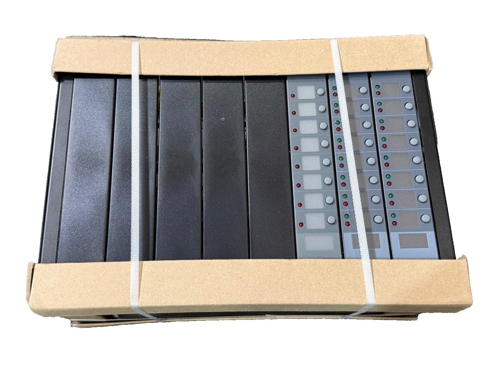 Fire alarm control panels in shipping box with indicator lights and buttons