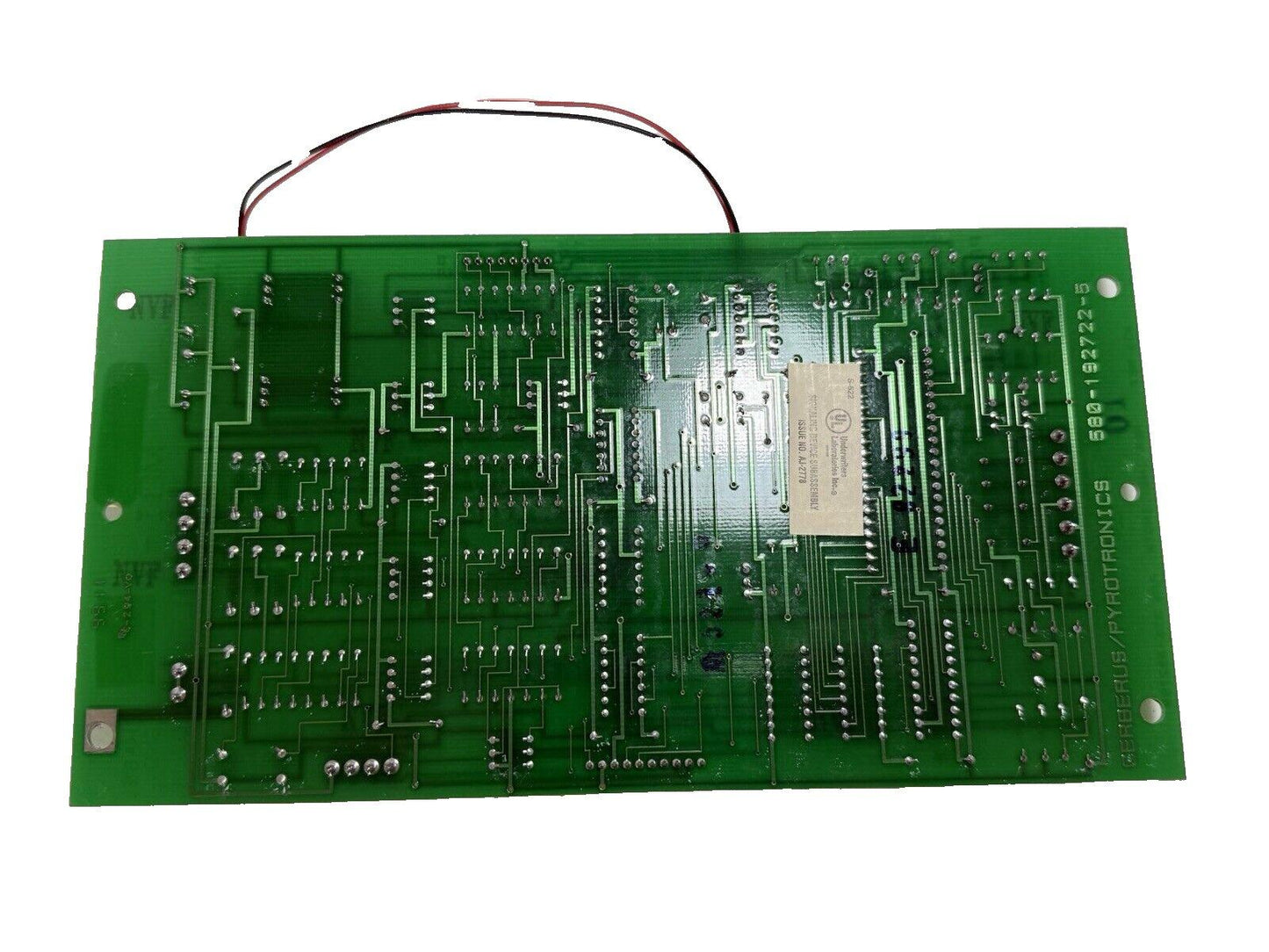 Green fire alarm control panel circuit board with wiring, labeled Cerberus/Pyrotronics for fire safety systems