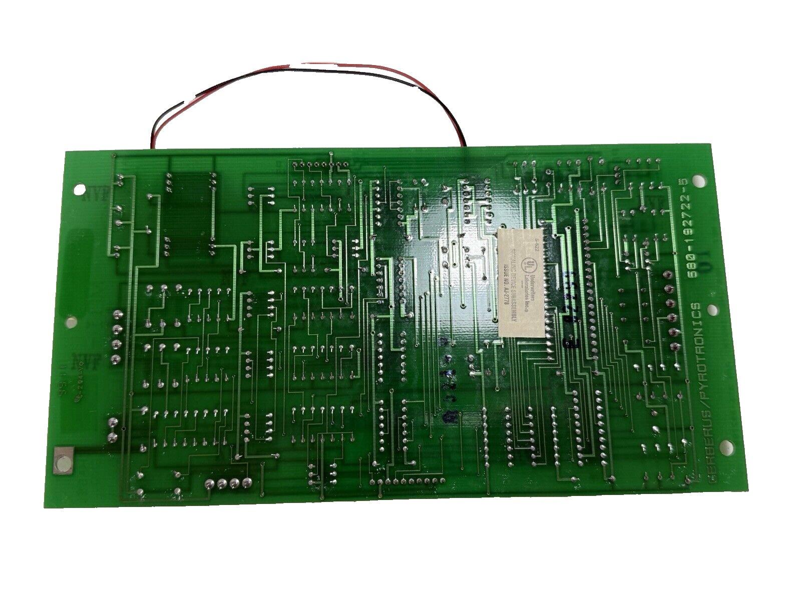 Green fire alarm control panel circuit board with wiring, labeled Cerberus/Pyrotronics for fire safety systems