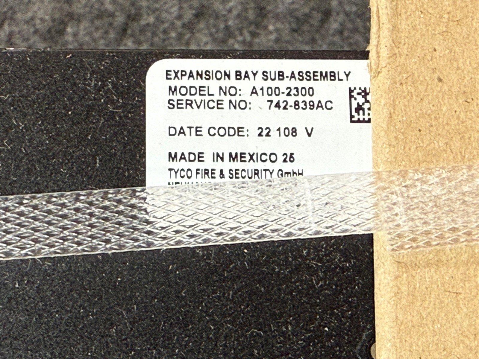 Tyco Expansion Bay Sub-Assembly A100-2300 fire alarm component, model label with service number and Mexico manufacturing details