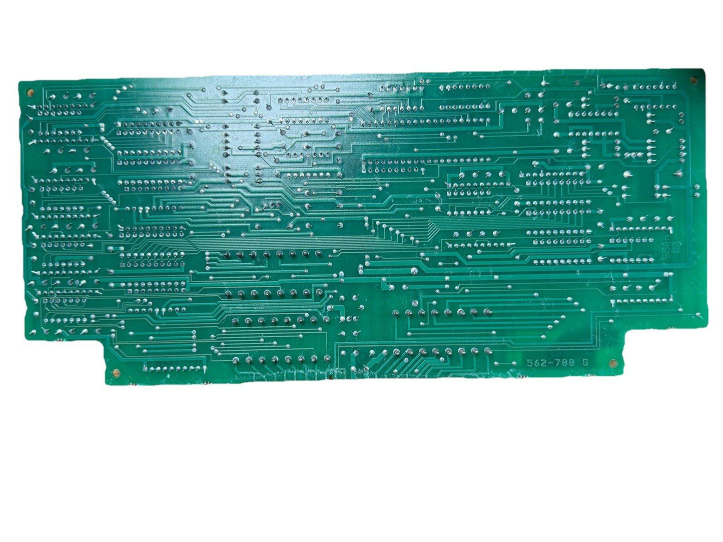 Green fire alarm control panel circuit board with solder points and traces, model 562-788