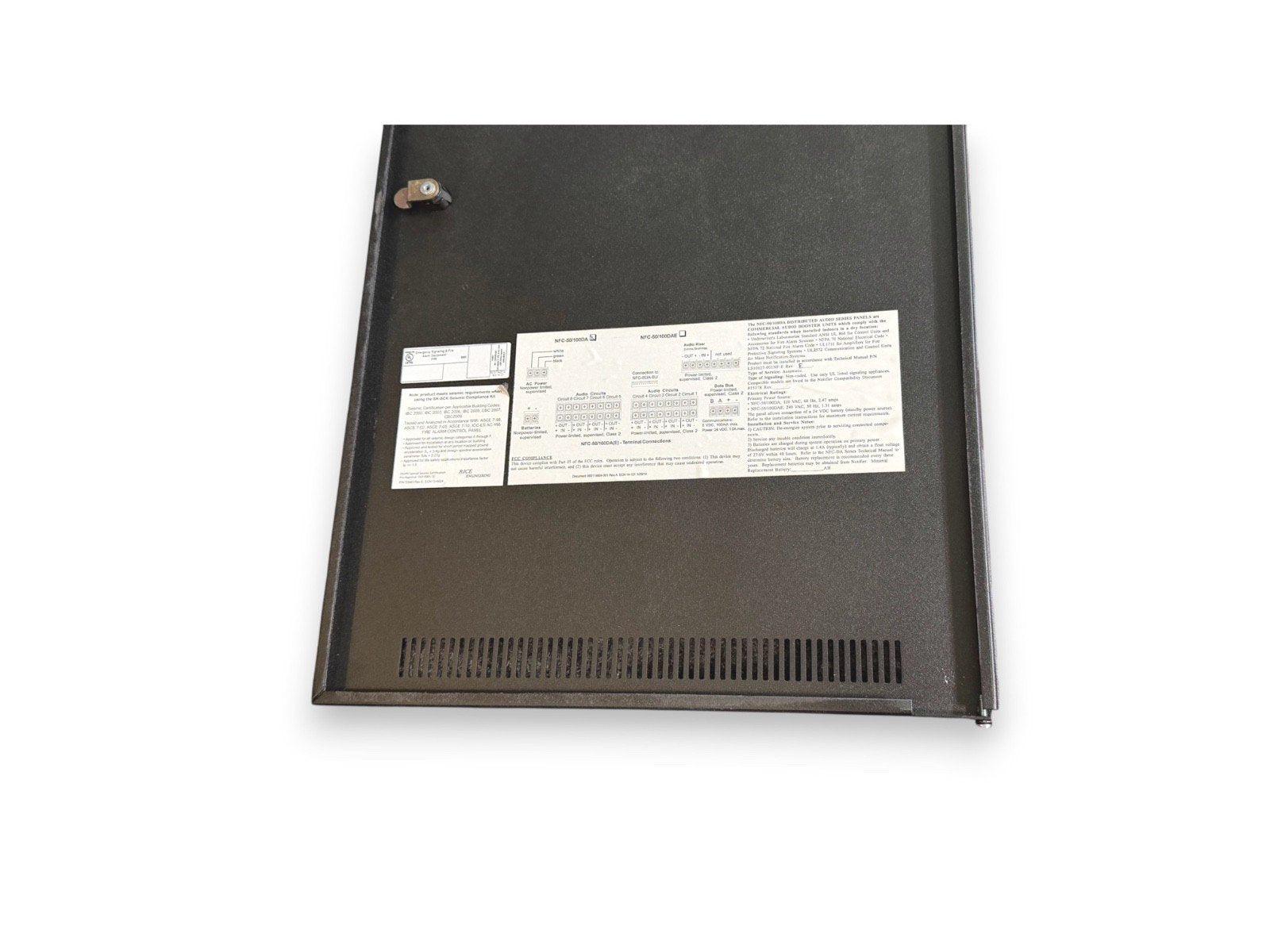 Fire alarm control panel with wiring diagrams and compliance labels, used fire alarm equipment