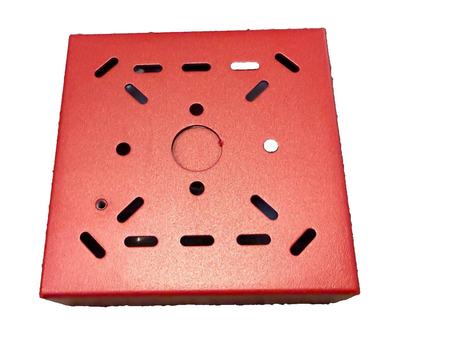 Red fire alarm pull station cover with mounting holes and slots for emergency use