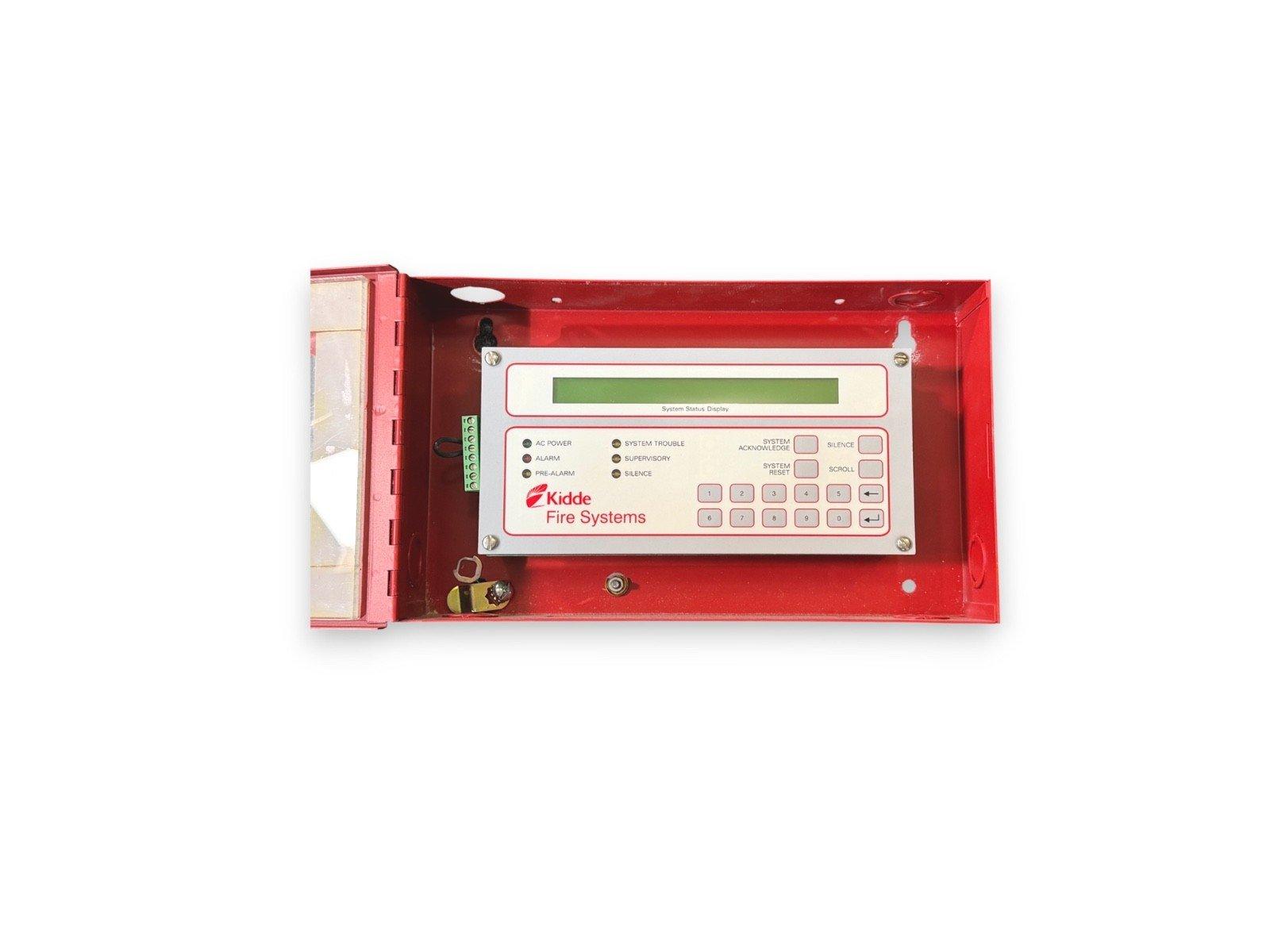 Kidde fire alarm control panel with keypad and status display in red enclosure