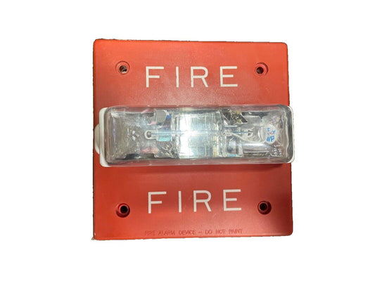 Red fire alarm pull station with clear cover and 'FIRE' label, used fire safety equipment
