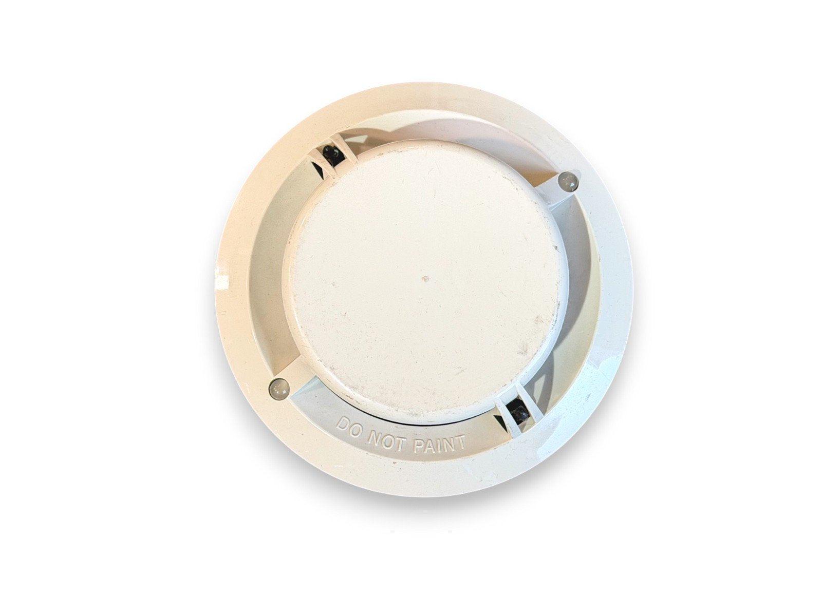 White ceiling-mounted fire alarm detector with 'DO NOT PAINT' warning, used fire safety equipment