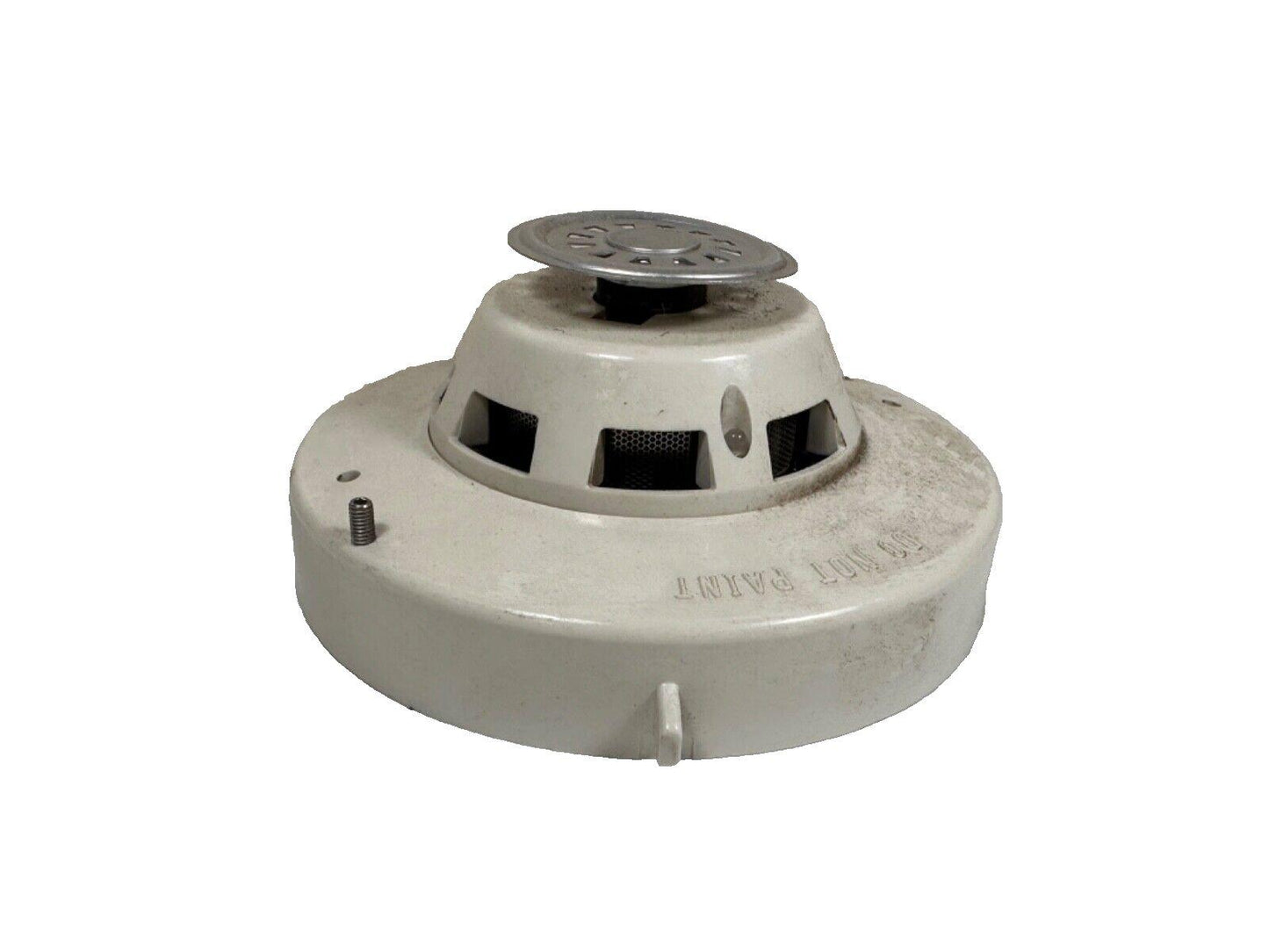 Used fire alarm smoke detector with metal cover and vented base, labeled 'DO NOT PAINT'