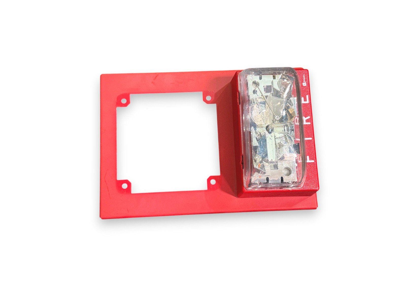 Red fire alarm pull station with clear cover and mounting plate, fire safety equipment