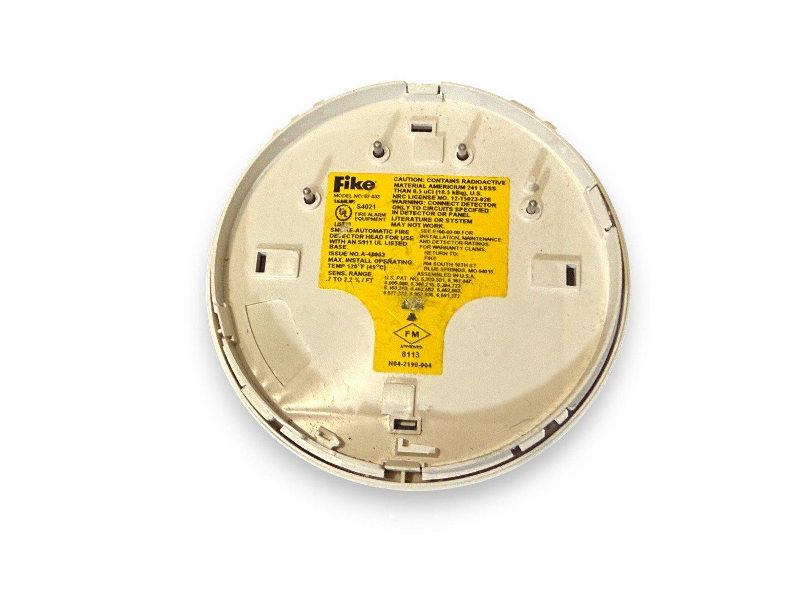 Fike smoke detector backplate with yellow warning label, model NY-67-833, for fire alarm systems