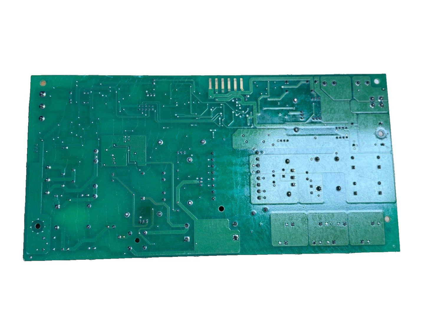 Green fire alarm control panel circuit board with solder points and traces