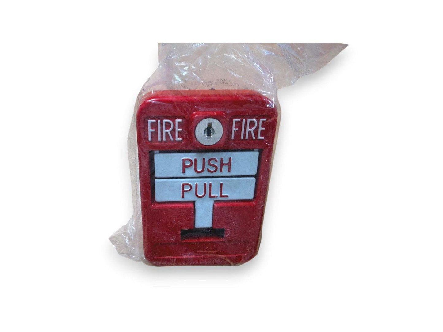 Red fire alarm pull station with push/pull lever, wrapped in plastic for shipping
