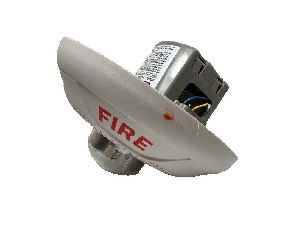 White fire alarm detector with red FIRE label and visible wiring, used fire safety equipment