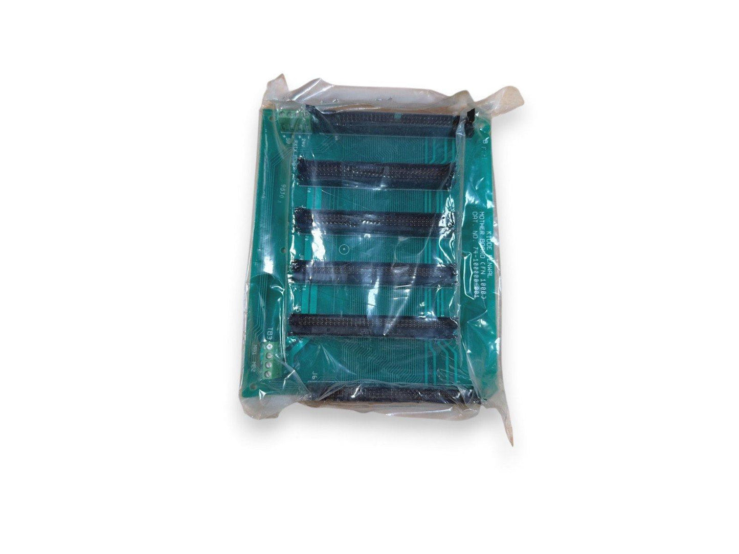 Green fire alarm control panel circuit board in plastic wrap, labeled with part numbers for system repair or upgrade.