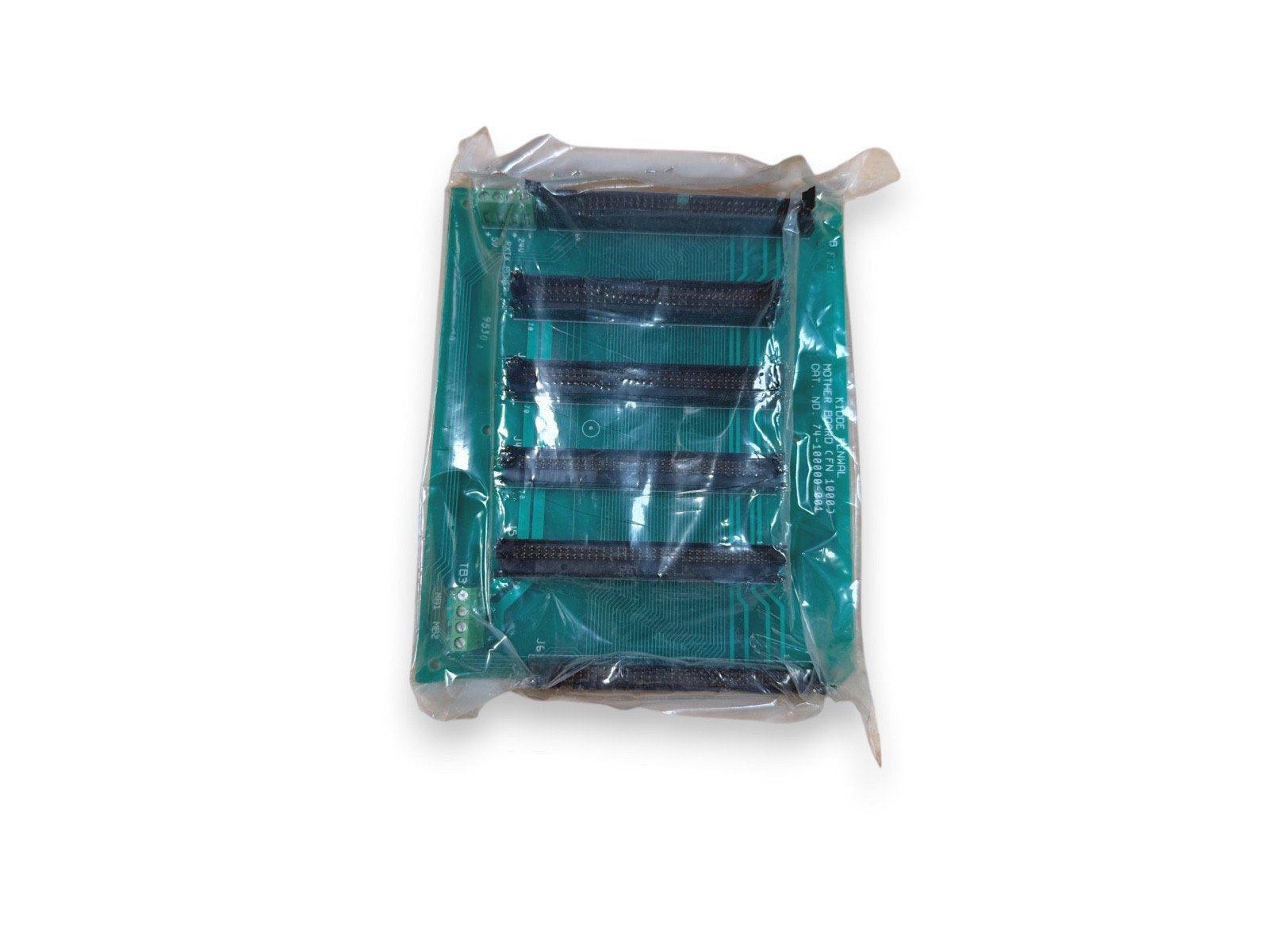 Green fire alarm control panel circuit board in plastic wrap, labeled with part numbers for system repair or upgrade.