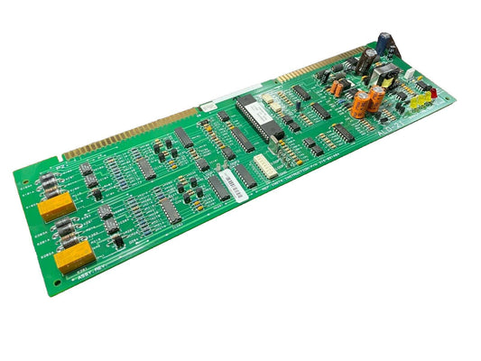 Green fire alarm control panel circuit board with capacitors, ICs, and connectors for fire safety systems