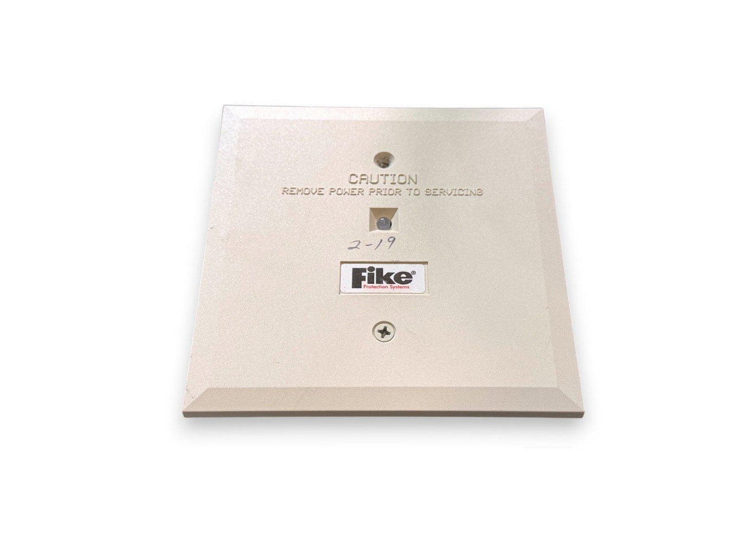 Fike fire alarm panel cover with caution label, used fire safety equipment